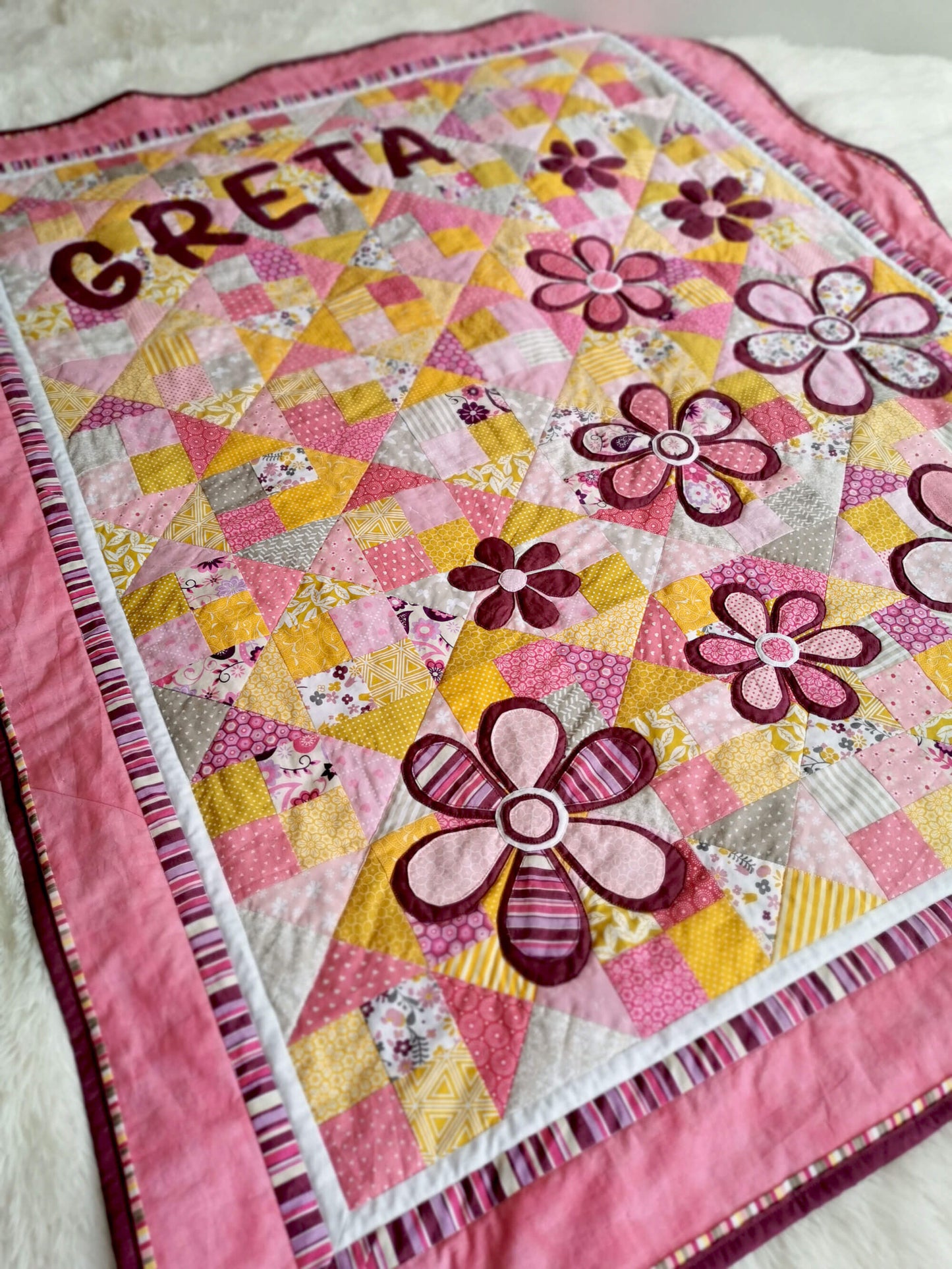 Darling quilt for a baby girl with girls name and many cute flowers