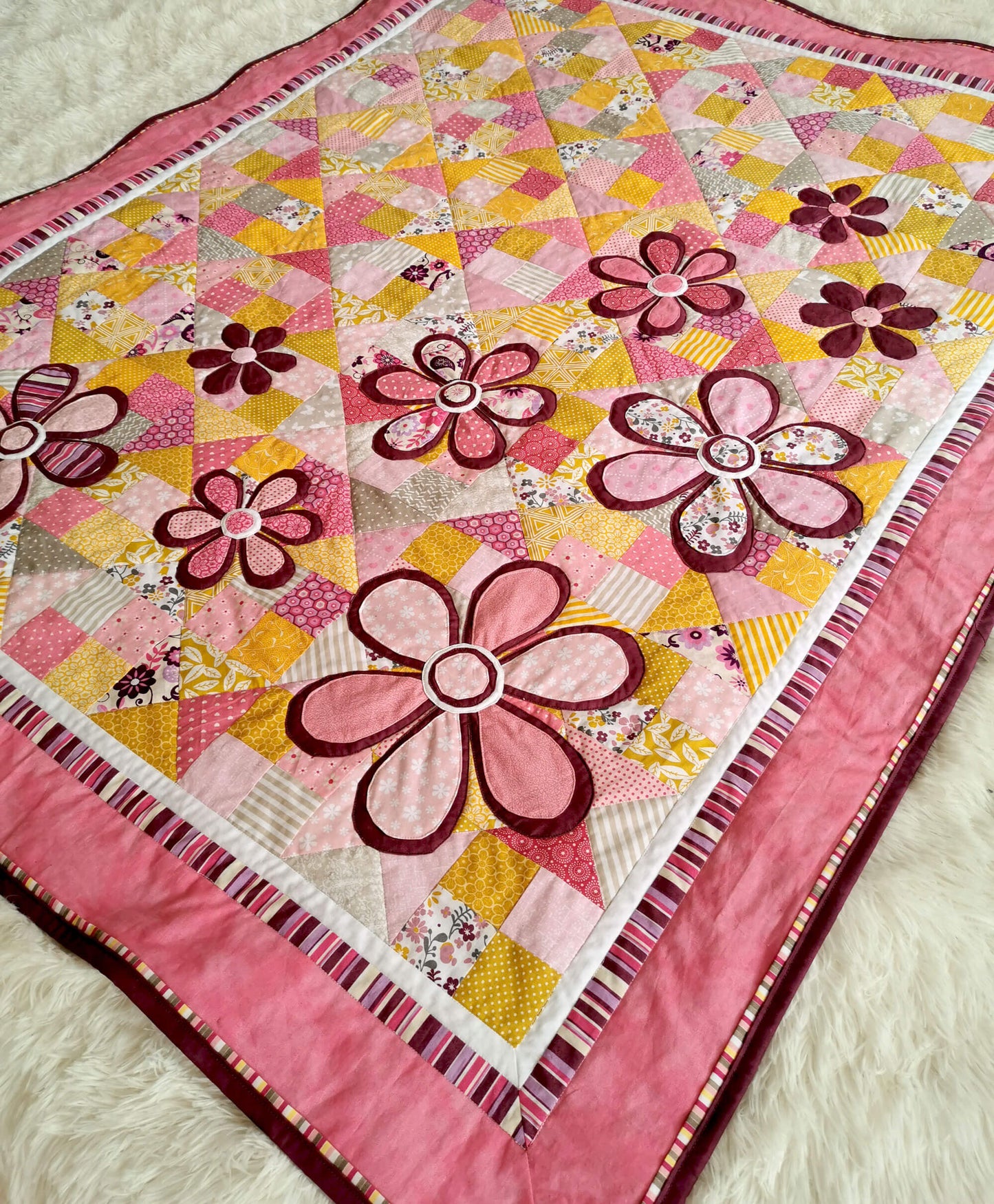 Cute baby girl quilt with flower applique