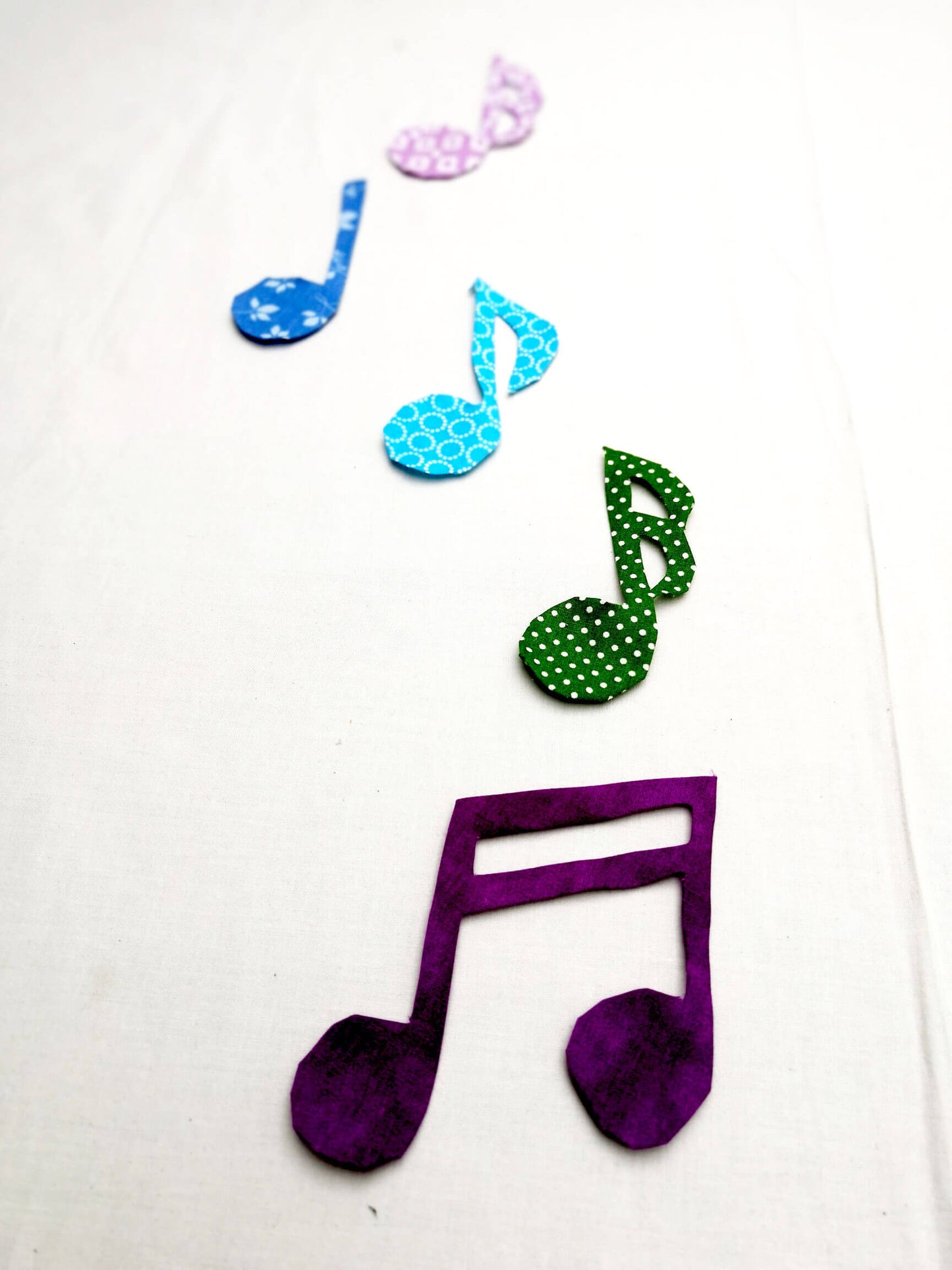 Colorful music note applique pieces