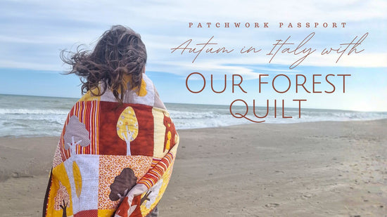Person wrapped in quilt on an empty beach with text overlay about 'Autumn in Italy with Our Forest Quilt'.