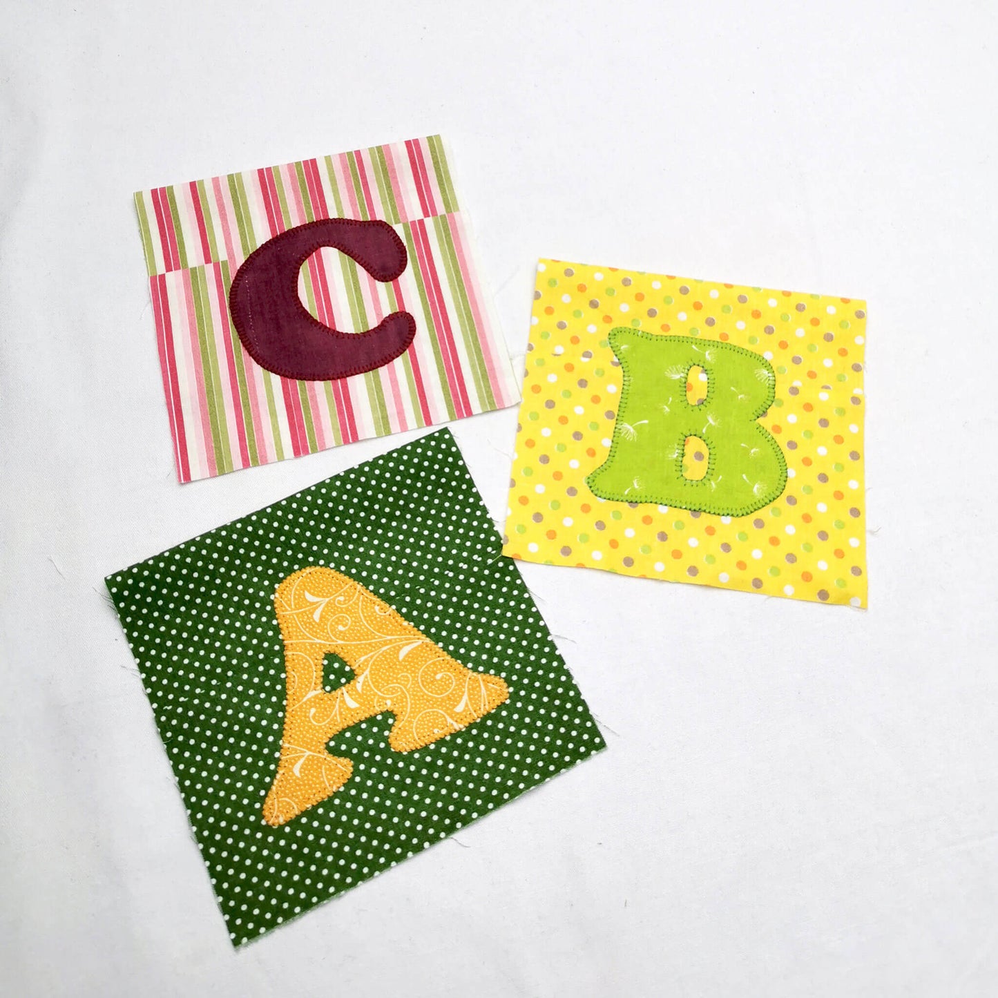 Raw edge letter applique