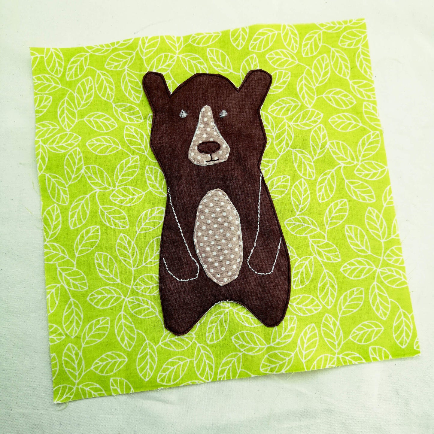 Bear appliqued on a fabric