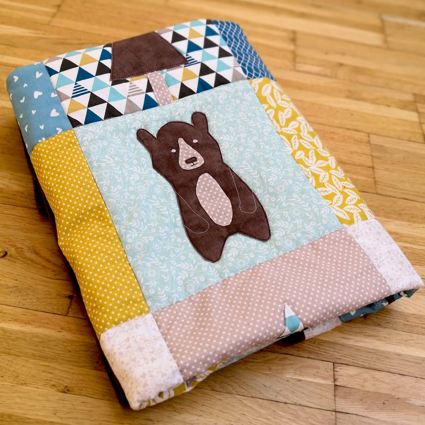 Cute bear appliqued on Our forest winter quilt