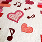 Fragment of "Music of Love" quilt with heart and music note appliques