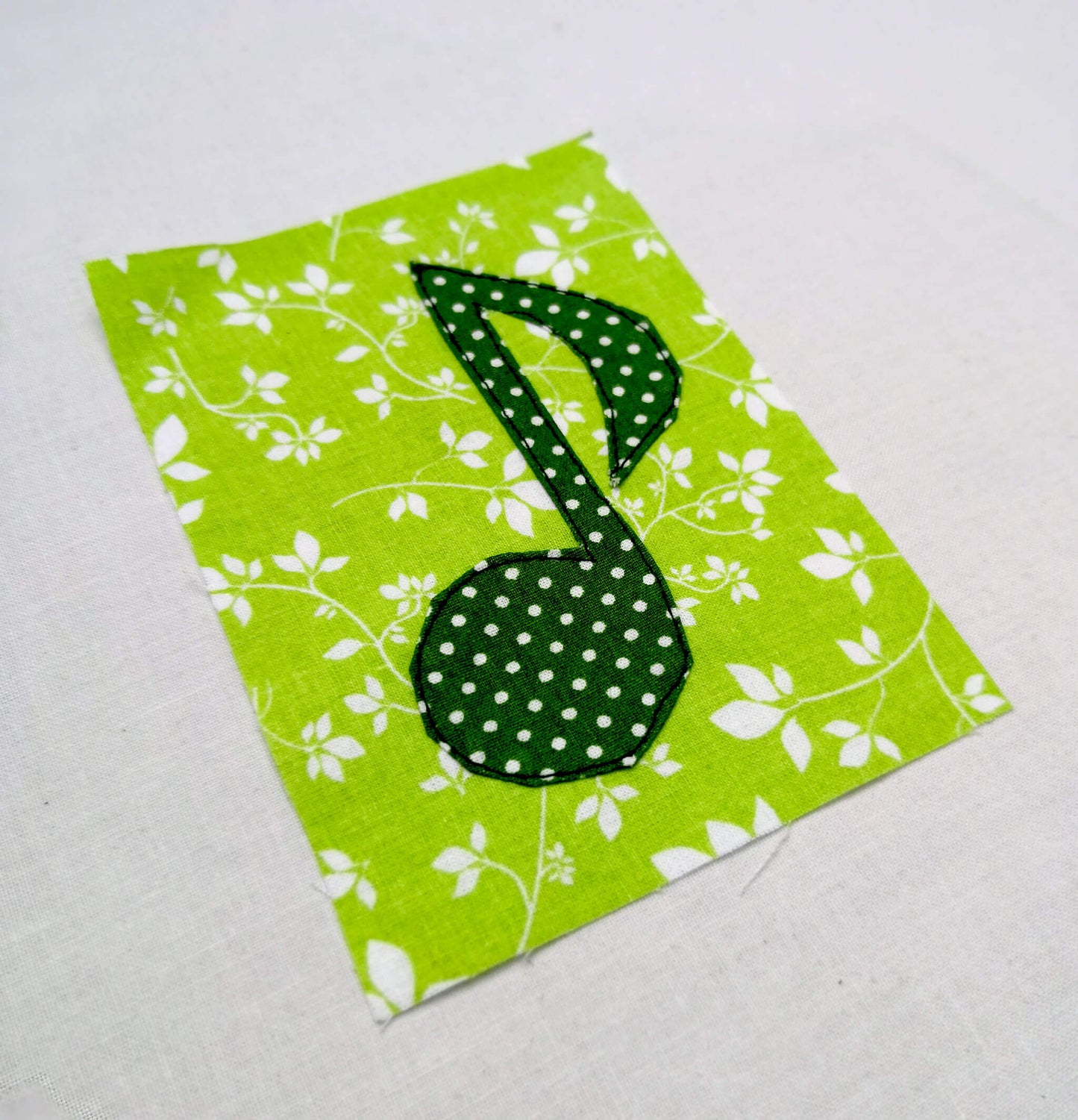 Music note applique on fabric