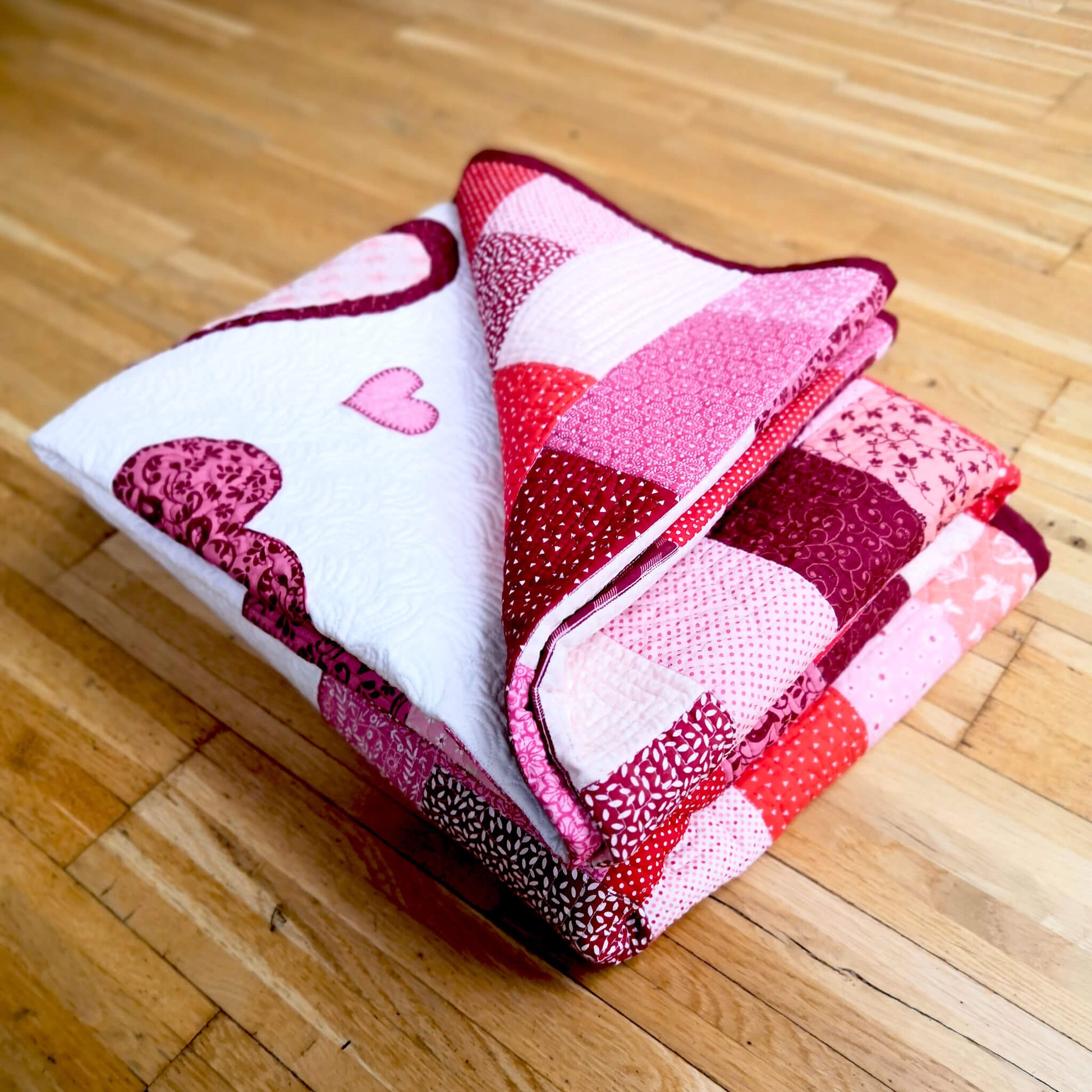 Heart appliqued on a quilt